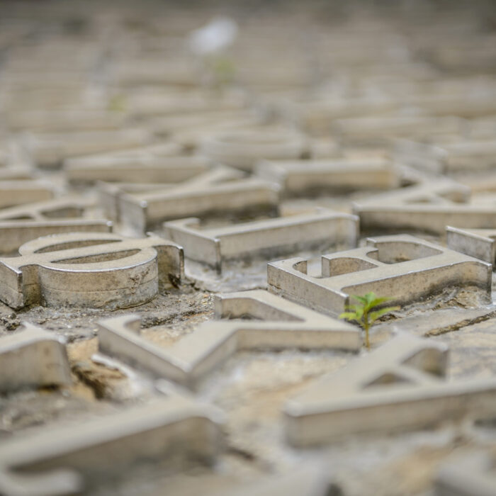 Close up of raised Greek letters.